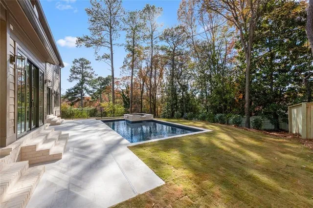 a bathroom with a bathtub and shower