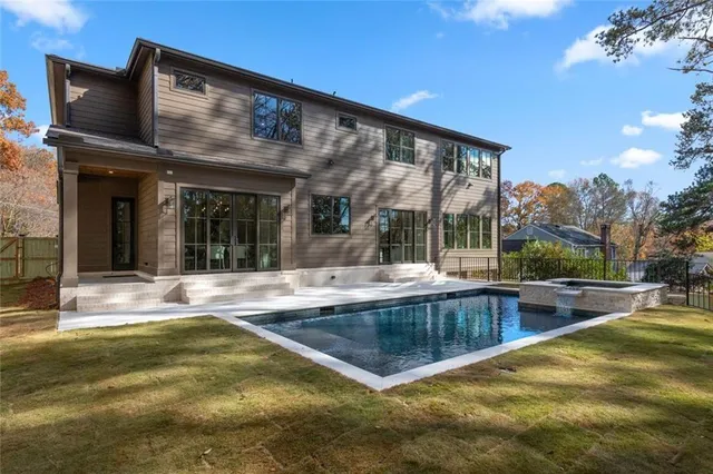 a view of a bathroom with a bathtub sink and mirror