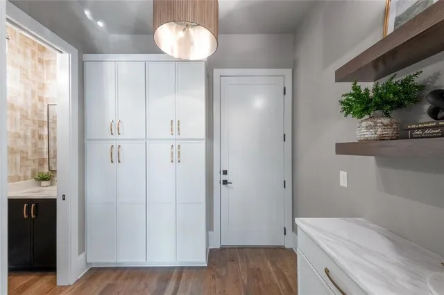 a bathroom with a granite countertop toilet a sink and bathtub