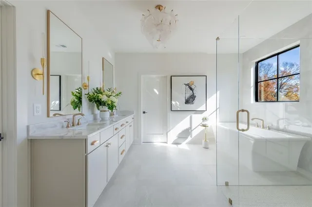 an empty room with ceiling fan and window