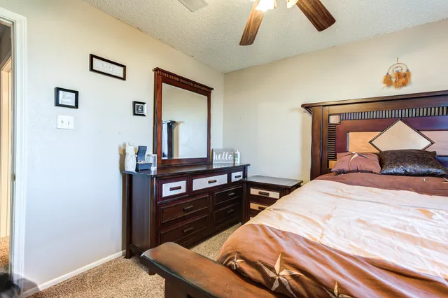 a bedroom with a bed and a dresser