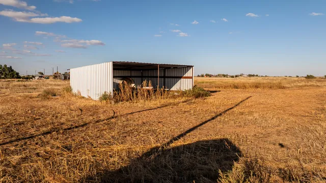 a view of ocean with large mountain