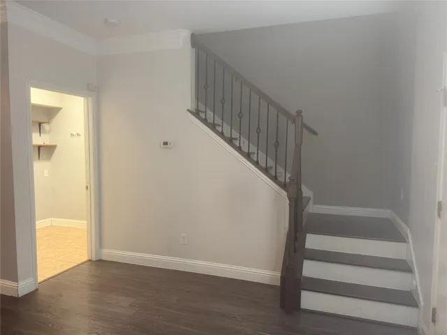 a view of entryway with wooden floor