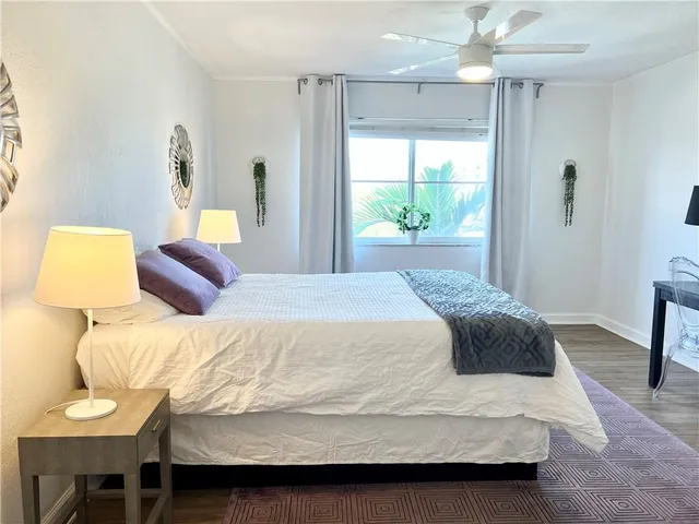 a bedroom with a bed and a lamp