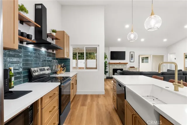a kitchen with a sink stove and microwave