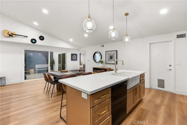 a large kitchen with a table and chairs