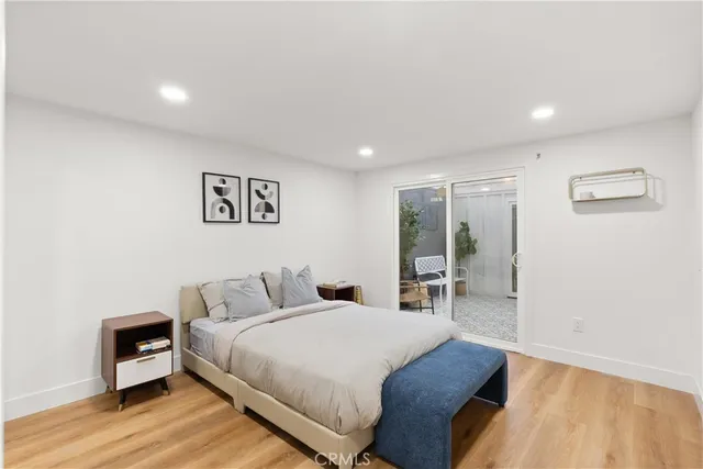 a bed room with a bed and a chair