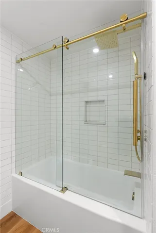 a bathroom with a shower and a bathtub