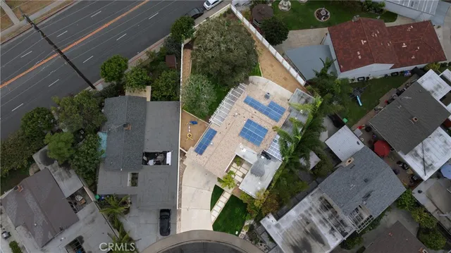 an aerial view of multiple houses with outdoor space