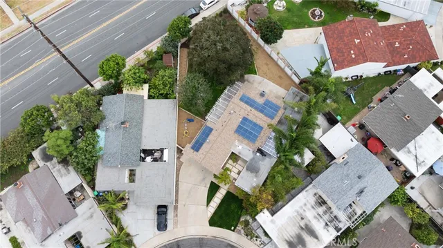 an aerial view of multiple houses with outdoor space