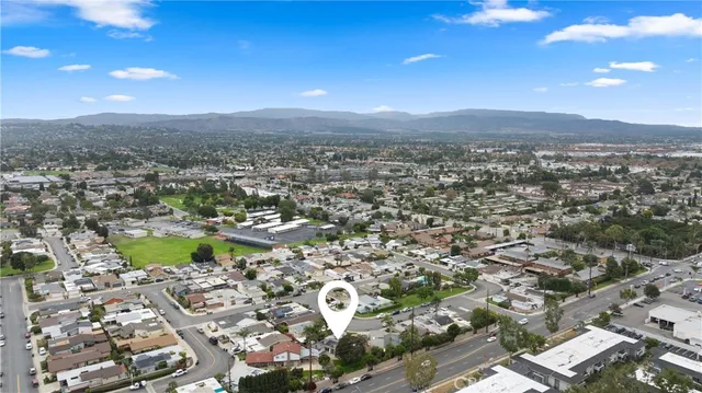 an aerial view of residential house with green space