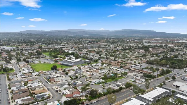 an aerial view of residential house with green space