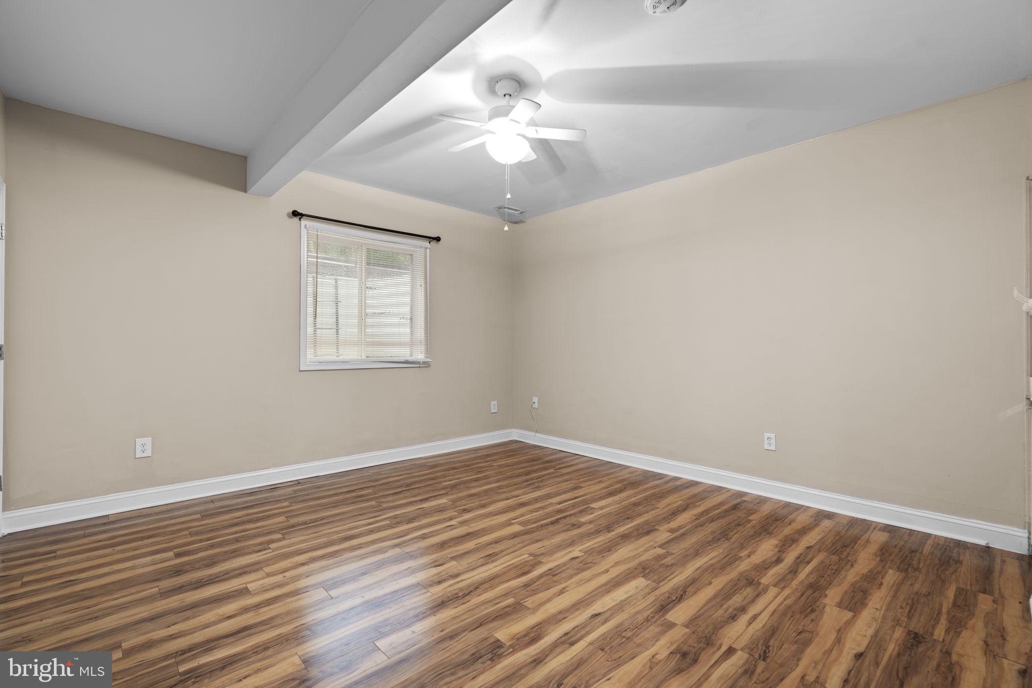 8024 Solley Road Glen Burnie, MD 21060 - Photo 68 of 83 wooden floor in an empty room with a window