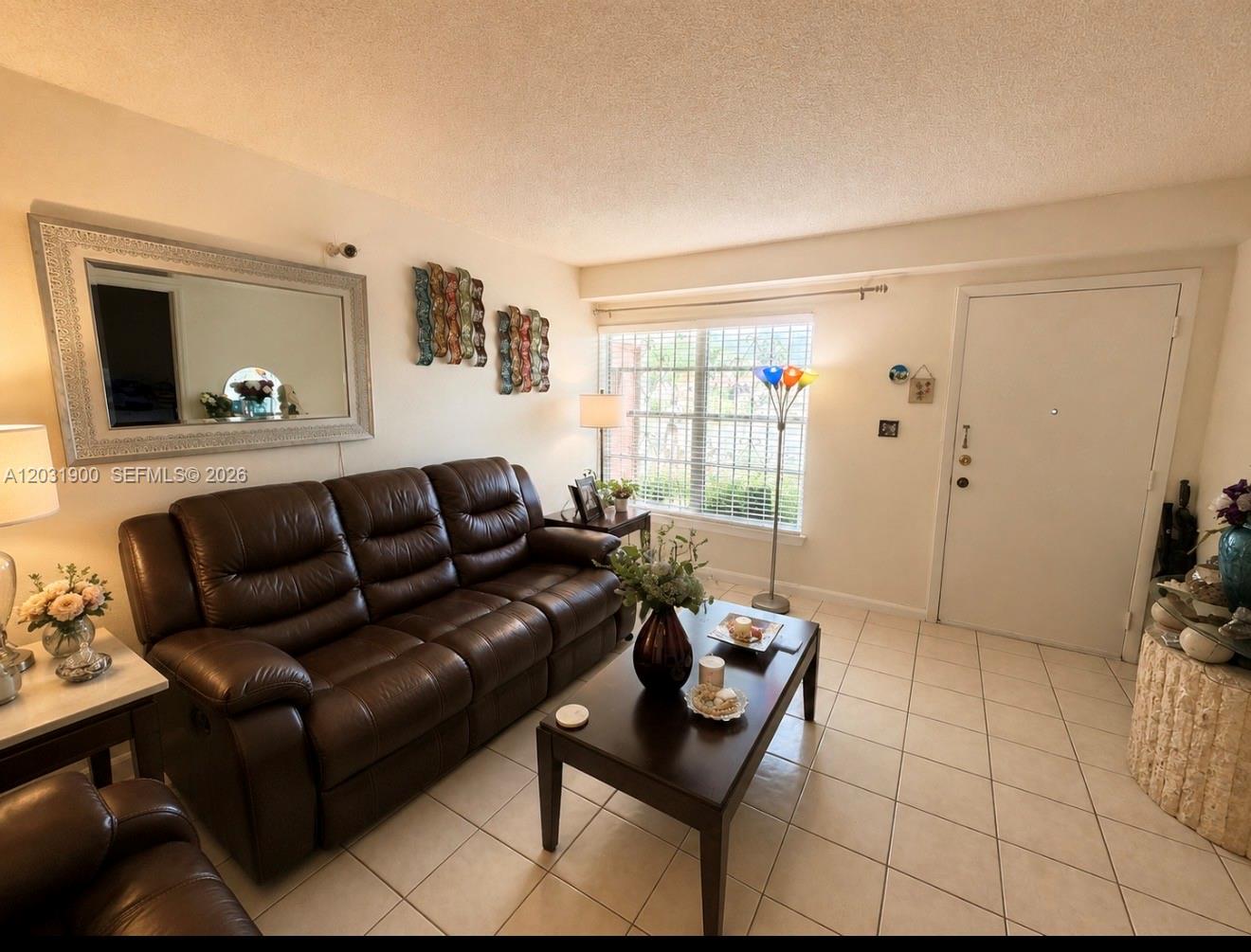12860 Southwest 43rd Drive, Unit 146B Miami, FL 33175 - Photo 12 of 12 a living room with furniture