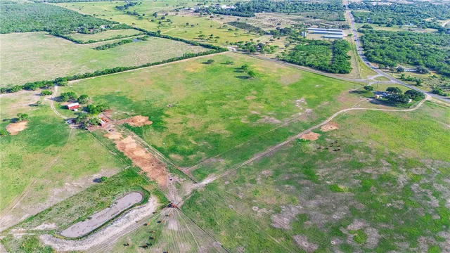 a view of a field with an ocean