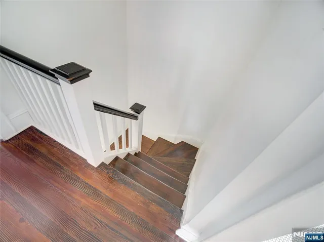 a view of entryway wooden floor and front door