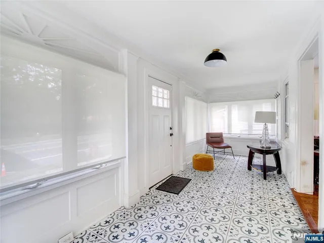 a bedroom with a bed dresser and a window