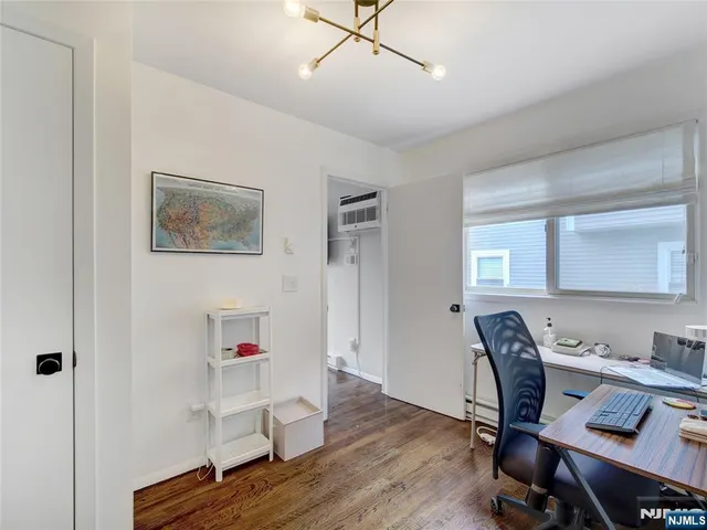 a workspace with furniture and wooden floor