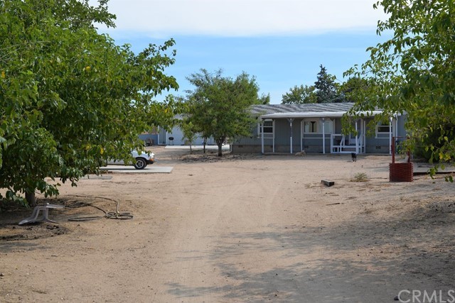 9229 Duncan Road Victorville, CA 92392 - Photo 1 of 1 front view of a house with a patio