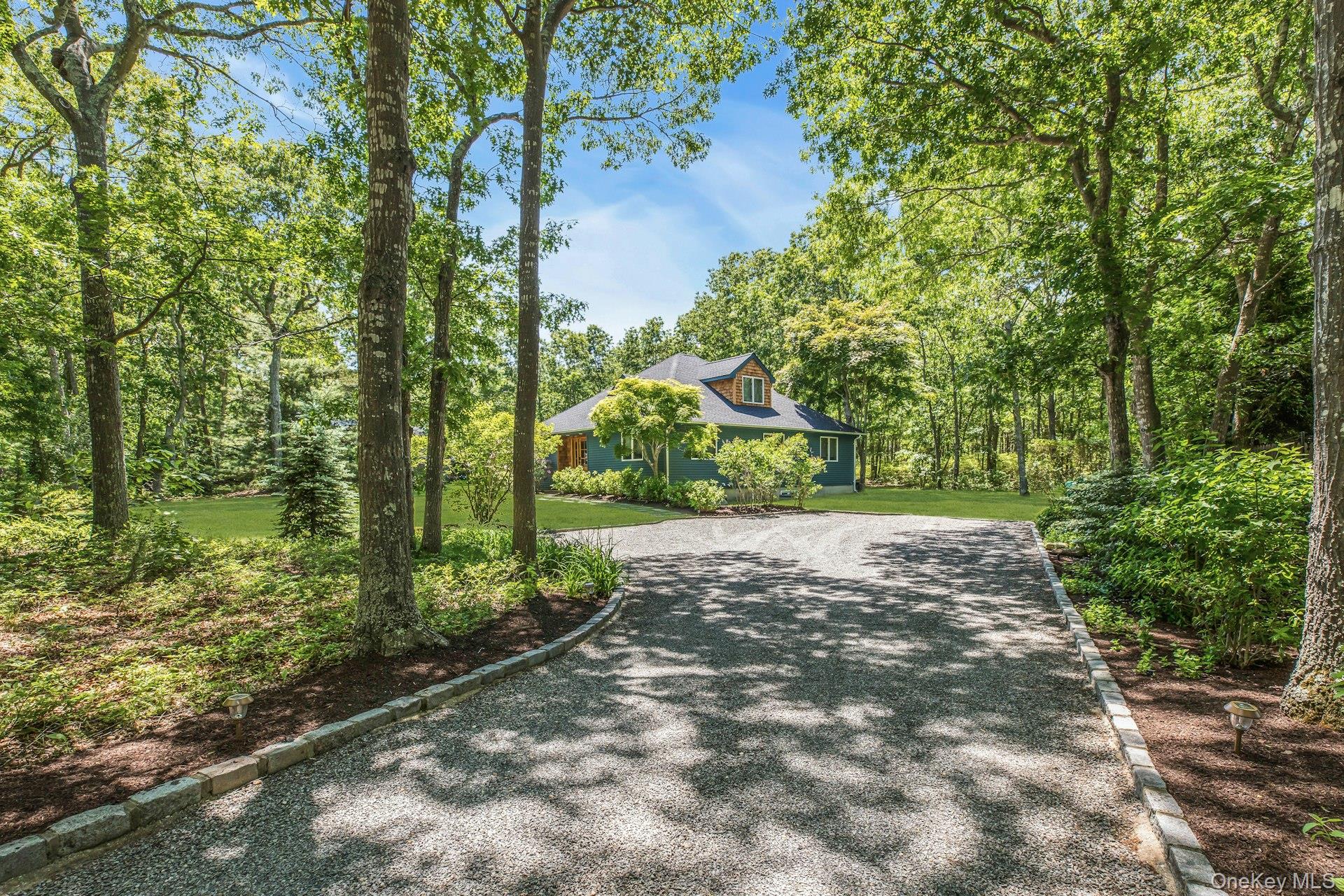 16 Hildreth Road Hampton Bays, NY 11946 - Photo 4 of 29 a view of a yard with plants and large trees