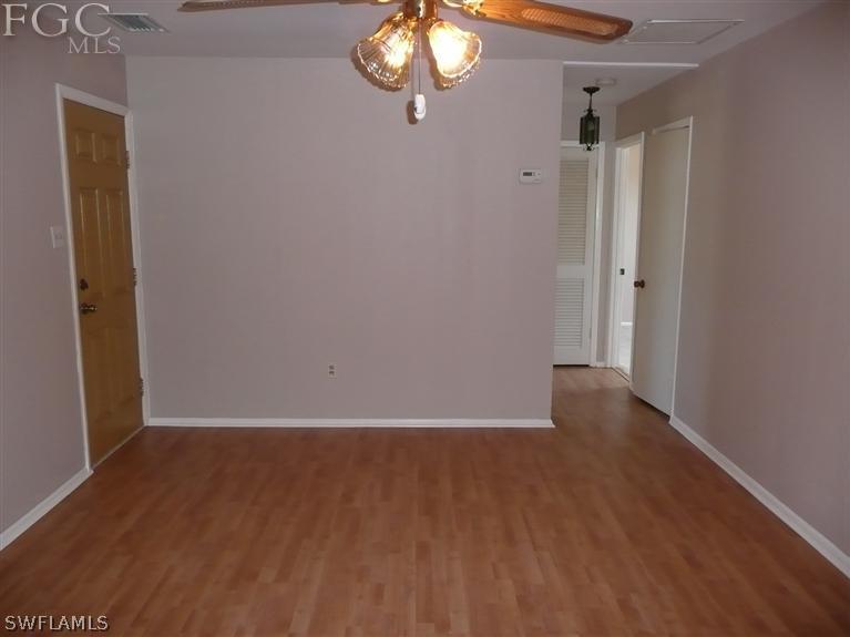 5952 Sailfish Road Bokeelia, FL 33922 - Photo 14 of 20 a view of an empty room with wooden floor and a window