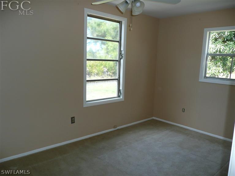 5952 Sailfish Road Bokeelia, FL 33922 - Photo 17 of 20 an empty room with a window