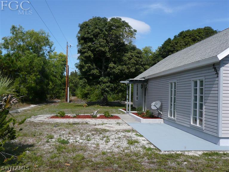 5952 Sailfish Road Bokeelia, FL 33922 - Photo 4 of 20 a view of backyard of the house