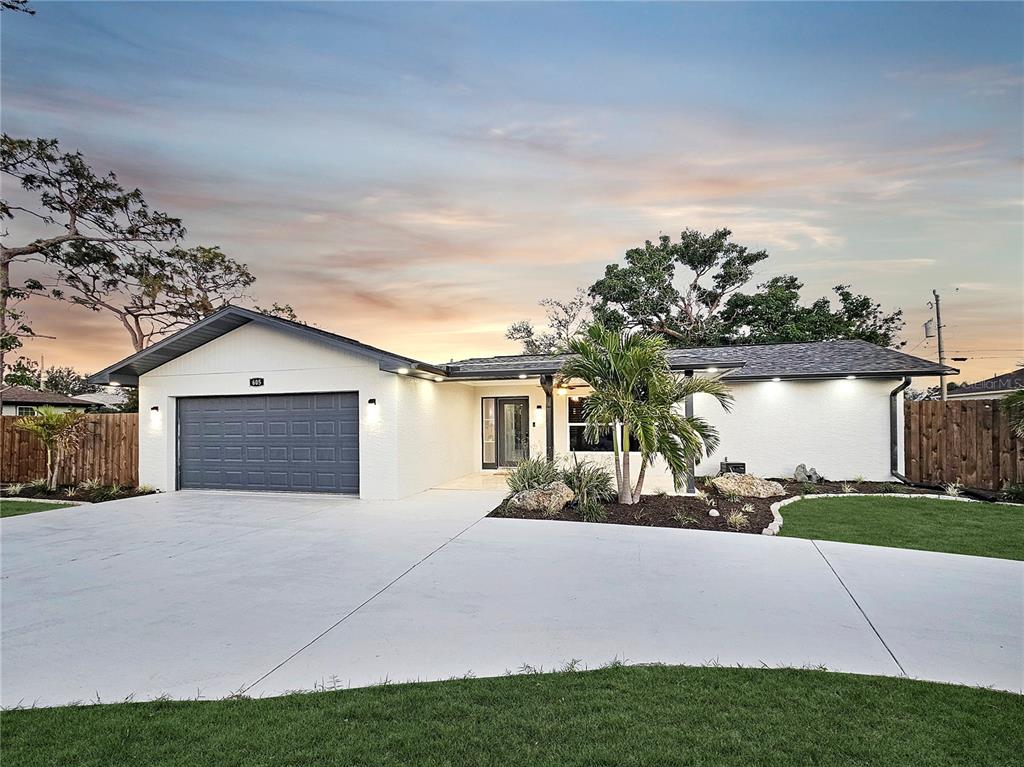 605 Cumberland Road Venice, FL 34293 - Photo 1 of 1 a front view of a house with garden