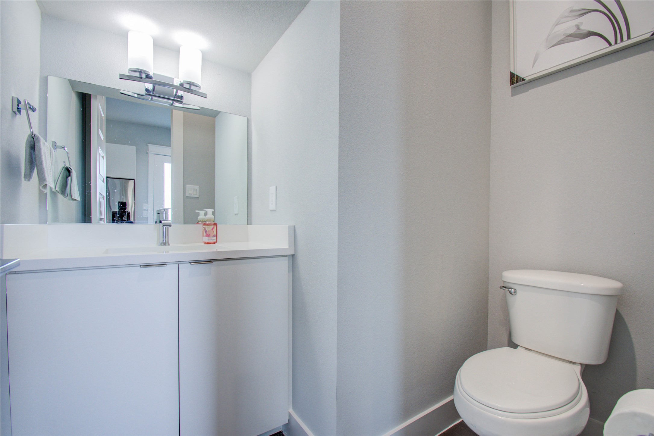2549 Hollister Road Houston, TX 77080 - Photo 12 of 16 a bathroom with a toilet a sink and mirror