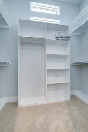 a view of an empty walk in closet
