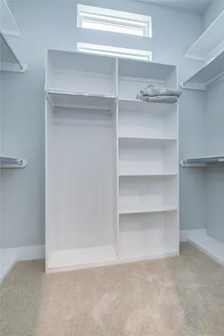 a view of an empty walk in closet