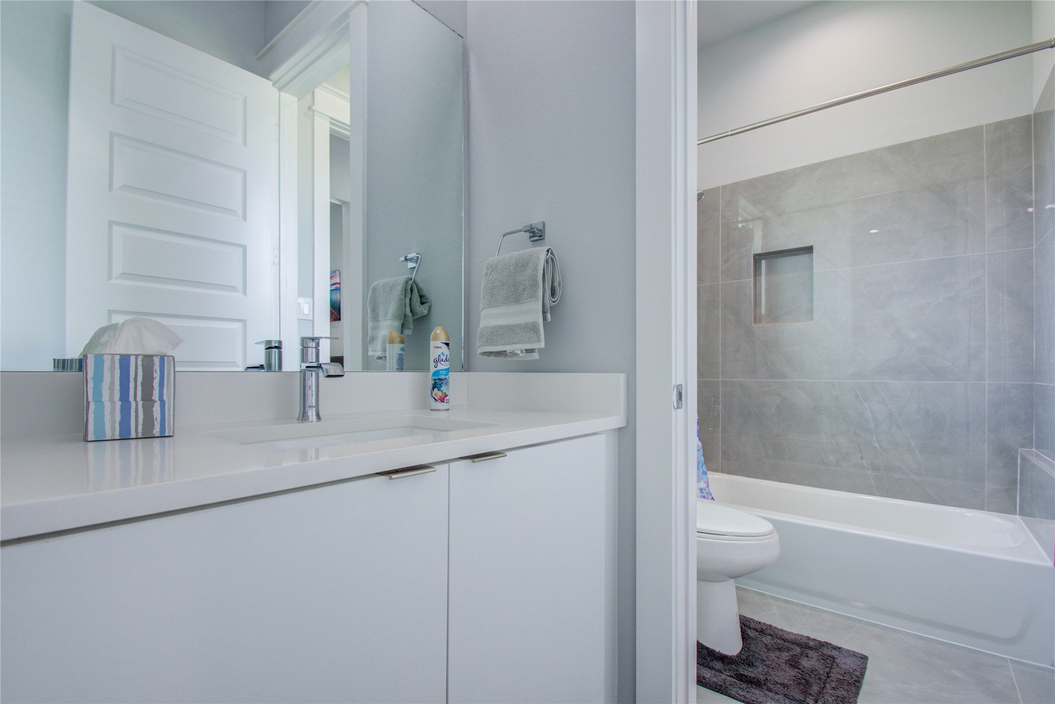 2549 Hollister Road Houston, TX 77080 - Photo 16 of 16 a bathroom with a granite countertop sink a toilet and bathtub