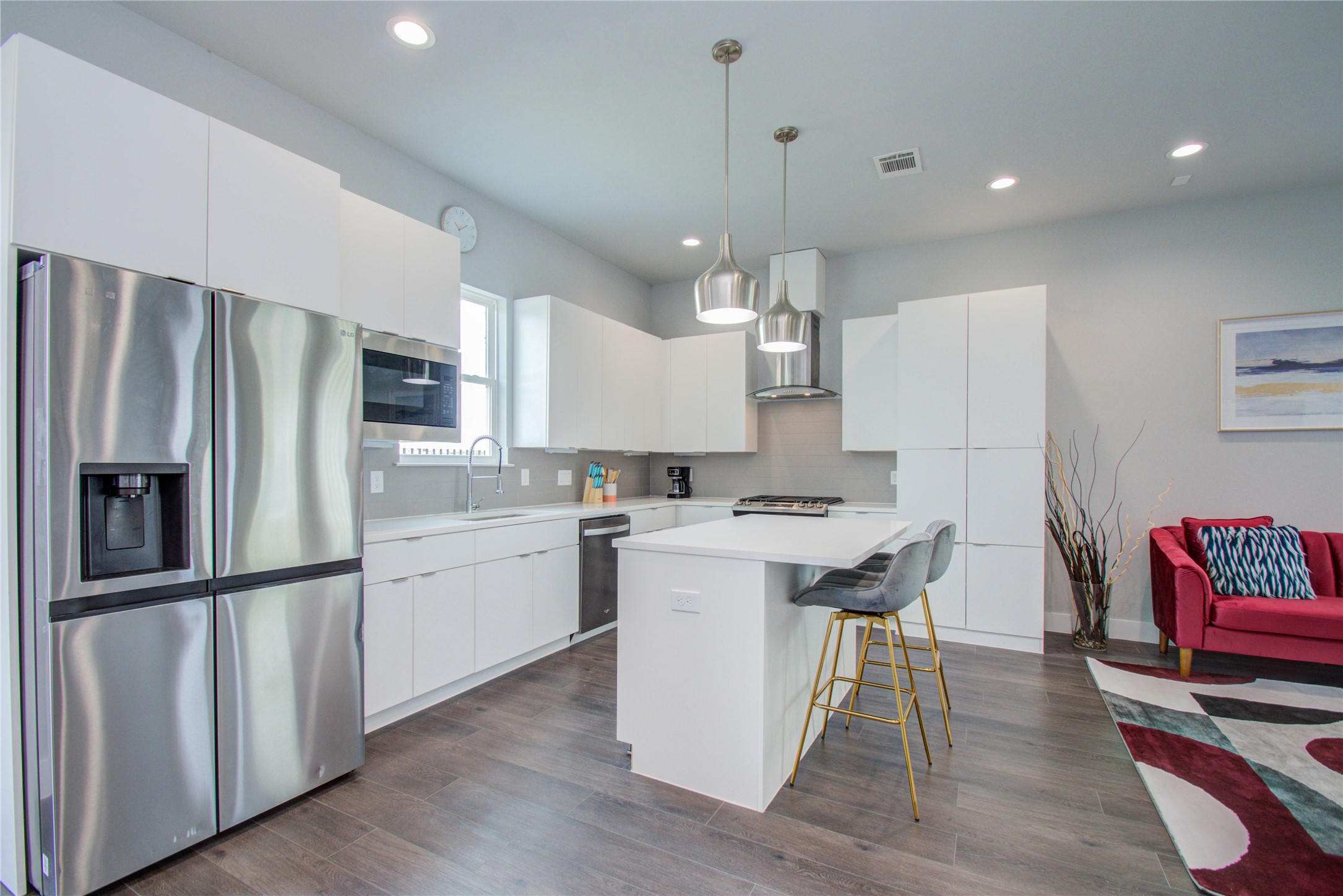 2549 Hollister Road Houston, TX 77080 - Photo 5 of 16 a kitchen with refrigerator microwave and stove