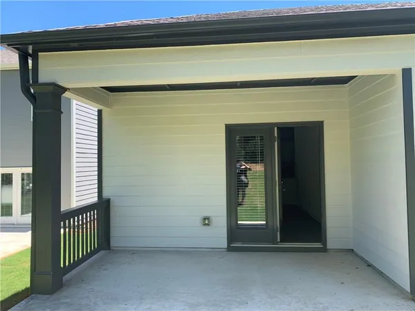 a view of a door and a window