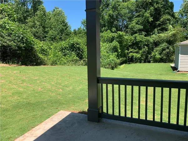a view of outdoor space with deck and yard