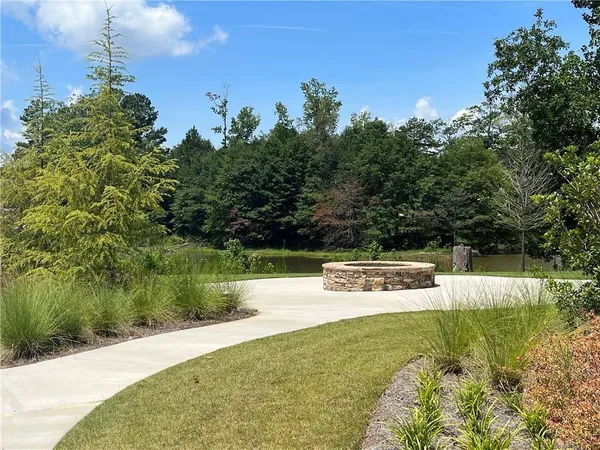 a view of a lake with houses with yard