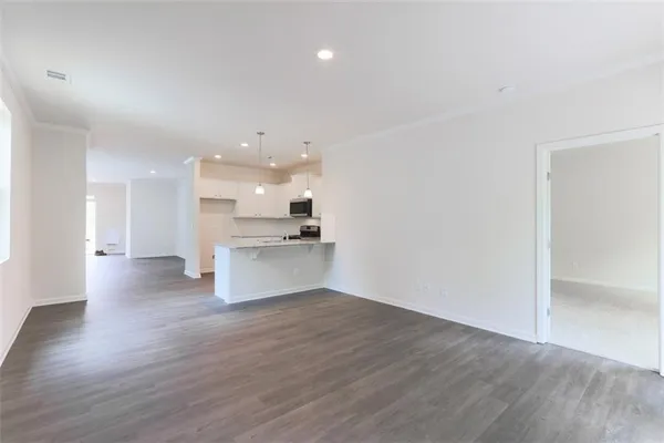 a view of kitchen with wooden floor