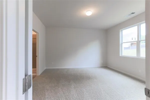 a view of empty room with windows