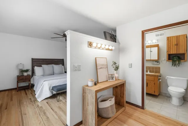 a room with a bed and a view of bathroom