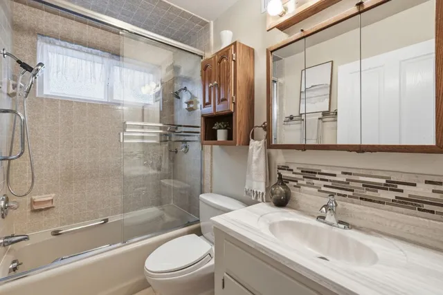 a bathroom with a sink a toilet and a bathtub
