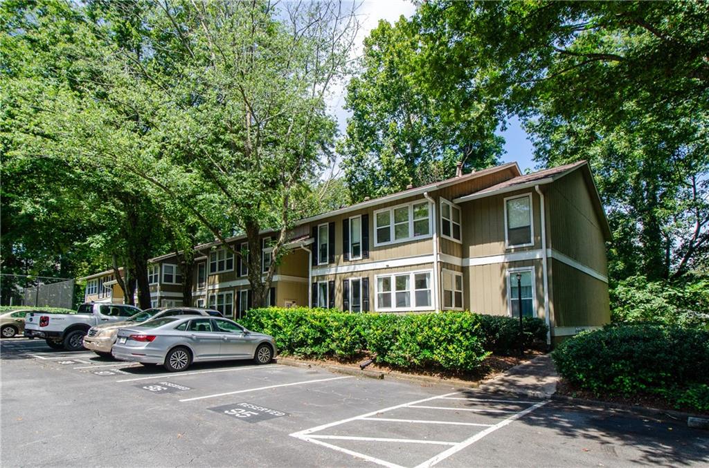 5157 Roswell Road, Unit 2 Atlanta, GA 30342 - Photo 1 of 24 a car parked in front of a white house