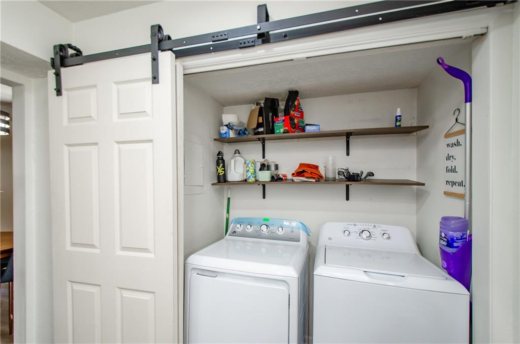 5157 Roswell Road, Unit 2 Atlanta, GA 30342 - Photo 16 of 24 a utility room with dryer and washer