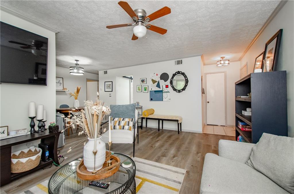 5157 Roswell Road, Unit 2 Atlanta, GA 30342 - Photo 6 of 24 a living room with furniture and a flat screen tv