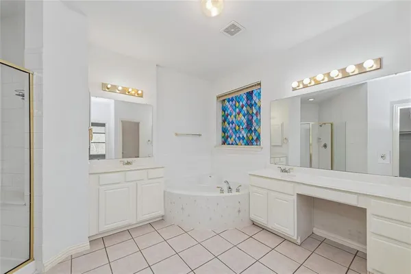 a bathroom with a sink a vanity and mirror