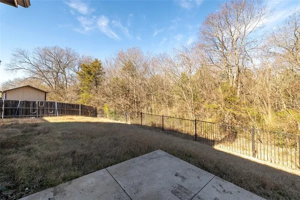 a view of a street with a building in the background