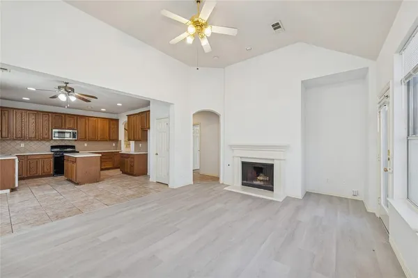 a view of kitchen with furniture and a fireplace