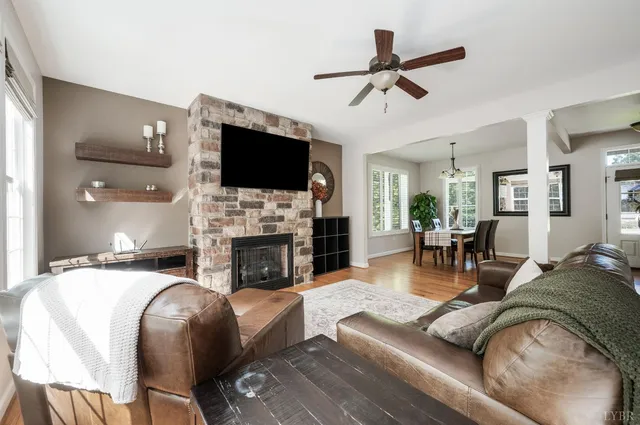 a kitchen with kitchen island granite countertop a sink appliances and cabinets
