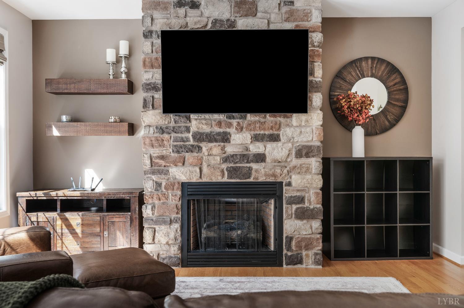 333 Sunset Ridge Drive Concord, VA 24538 - Photo 19 of 61 a living room with furniture a flat screen tv and a fireplace