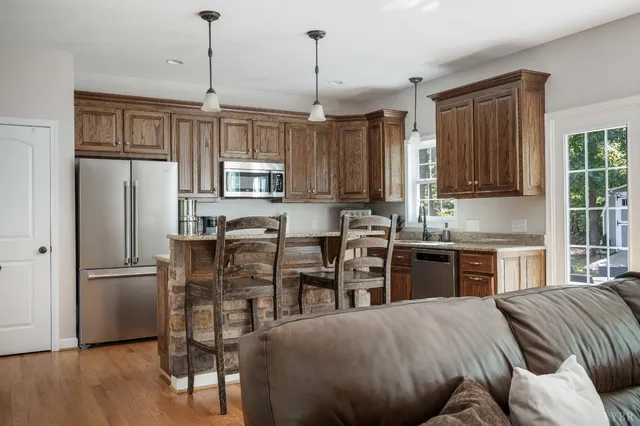 a living room with furniture dining table and a fireplace