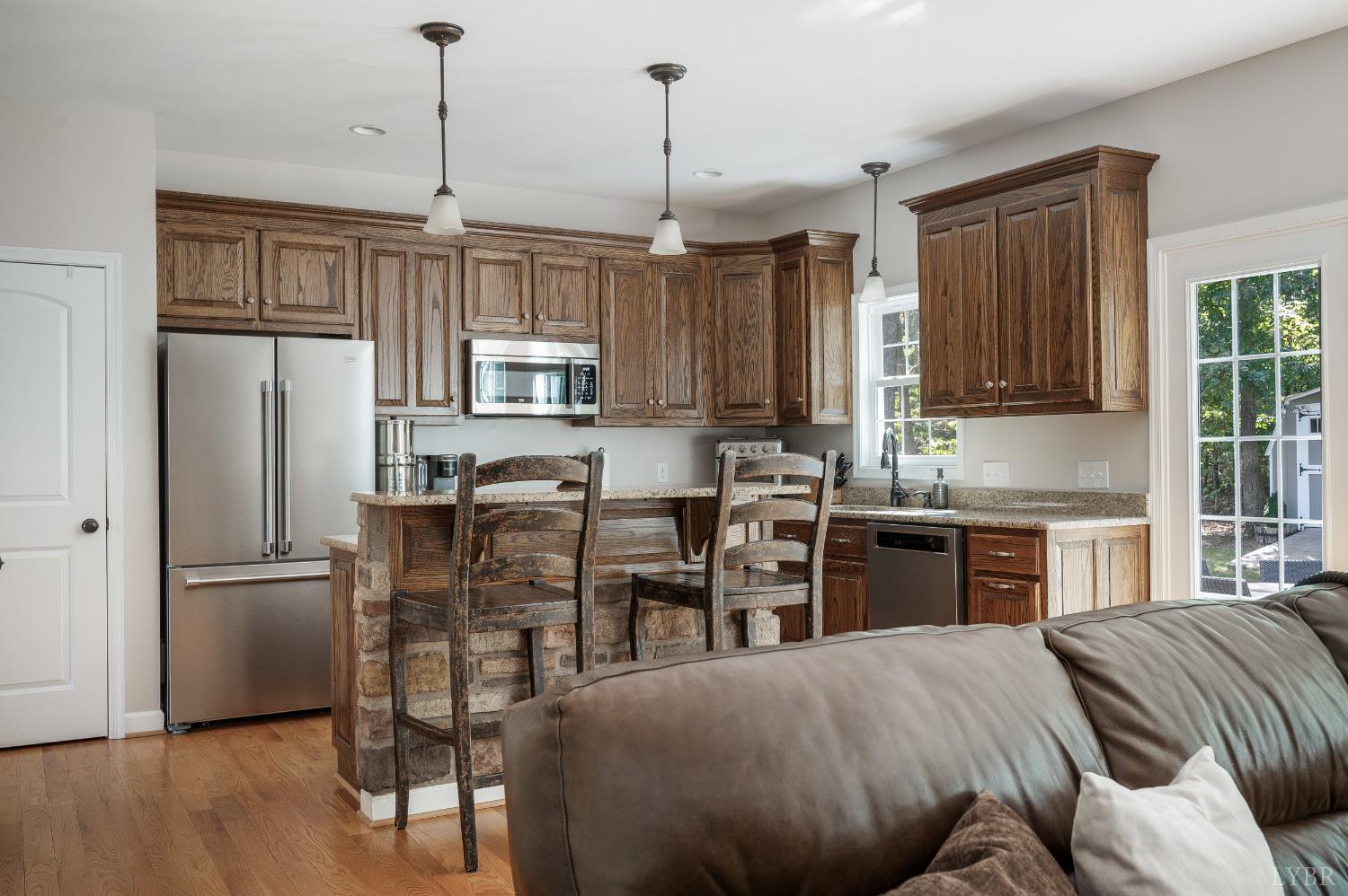 333 Sunset Ridge Drive Concord, VA 24538 - Photo 24 of 61 a kitchen with granite countertop a refrigerator stove top oven and sink